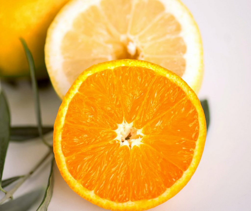 Orange slice close-up with rosemary