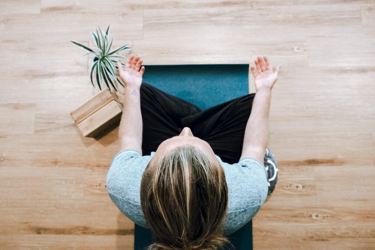 Woman meditating and stretching