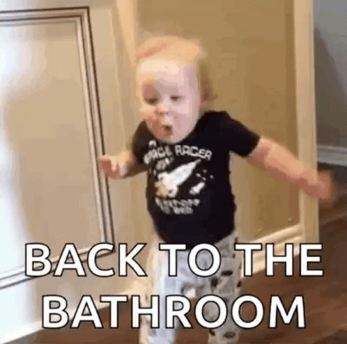 Short clip of a baby running one way then turning around quick to go the other way with the caption of back to the bathroom overlayed